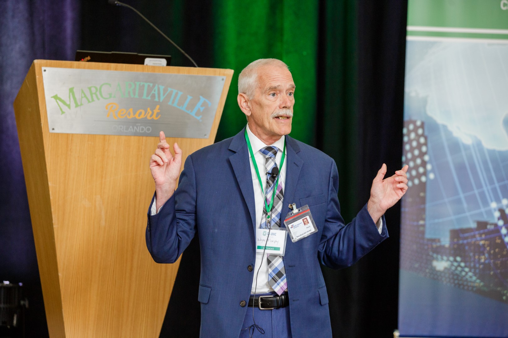 Wayne Murphy speaking at the C4UHC Symposium
